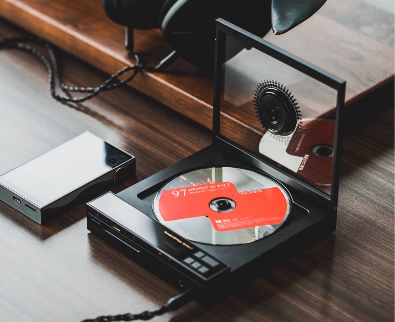 Close-up of Shanling ECZero T CD player with audiophile headphones