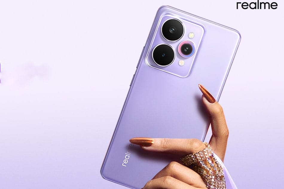 Realme smartphone in purple held in hand